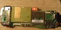 The backside of the mainboard, exposing the SIEMENS GSM Module, and SD Card slot