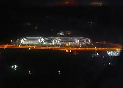 Night-time satellite view of Al-Shahaniya Camel Racetrack and nearby buildings