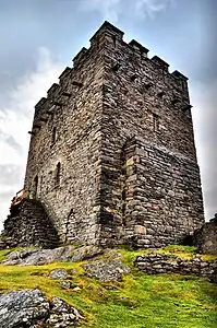 The exterior of the keep showing the remains of the forebuilding and the rebuilt south wall and battlements