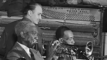 Ewell (top) playing piano in c. June 1946