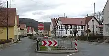 A roadway through a village.