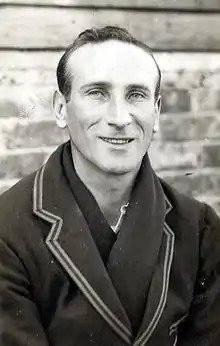 Headshot of a man in a blazer