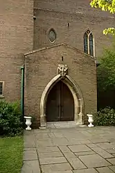 Hill's keystone carving of a dove over the north door