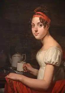 Adéone holding the teacup