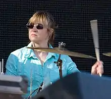 Hubley seated behind a drum kit