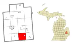 Location within Lapeer County (red) and the administered village of Dryden (pink)