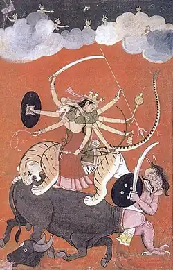 An 18th century painting of the goddess Durga fighting Mahishasura