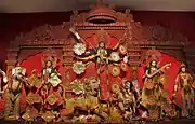 Durga Puja is a multi-day festival in Eastern India that features elaborate temple and stage decorations (pandals), scripture recitation, performance arts, revelry, and processions.