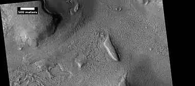 Layered features and brain terrain, as seen by HiRISE under HiWish program The upper plains unit often changes into brain terrain.