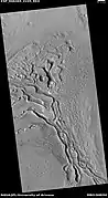 Wide view of terrain caused by ice leaving the ground, as seen by HiRISE under HiWish program