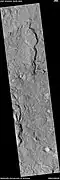 Channel along edge of crater ejecta, as seen by HiRISE under HiWish program  Arrows show channel.