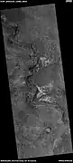 Light-toned material, as seen by HiRISE under HiWish program  Light-toned material is often associated with minerals that formed in water.