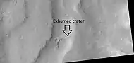 Exhumed crater, as seen by HiRISE under HiWish program After its formation, the crater was buried, now it is being exposed by erosion.