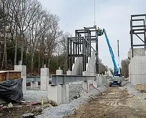 A railway station with a footbridge under construction