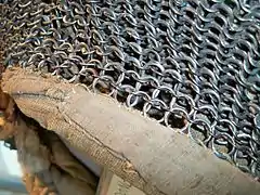 Close up detail of Mughal riveted mail hood kulah zirah, 17th century, alternating rows of round riveted rings and solid rings.