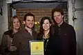 Nick and Helen Forster present the eChievement Award to environmentalist Lauren Sullivan (2nd from right) and her musician husband, Guster guitarist/vocalist Adam Gardner (2nd from left), of Reverb.