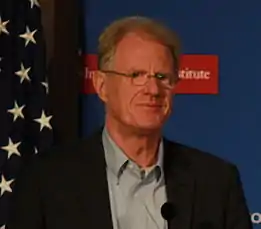 Man in sports coat and blue shirt