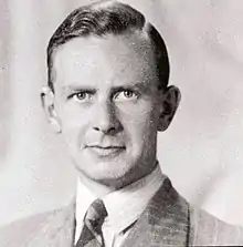 Head and shoulders of young man in suit and tie