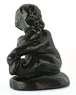 Colour photograph of a bronze figurine of an infant by Edith Maryon