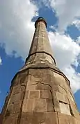 Islamic stone artwork depressions on the tower base.