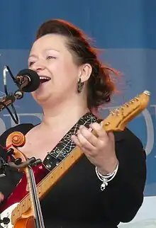 Carthy on stage at the 2011 Wychwood Festival