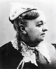 Black-and-white portrait photo of Eliza Tibbets, an older white woman wearing a small hat.