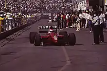 Emanuele Pirro driving for Scuderia Italia at the 1991 United States Grand Prix.