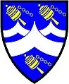 a chevron embowed - Azure; a chevron embowed between two chevronels embowed in fess, argent, all between three prayer wheels bendwise or - Hilary, New Zealand