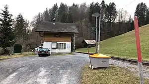 Two-story station building with gabled roof