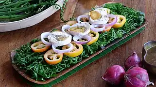 Ensaladang pako (fern salad)  with salted egg from the Philippines