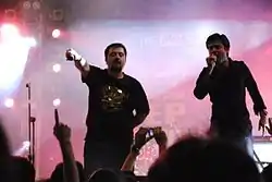 Two men performing at a concert