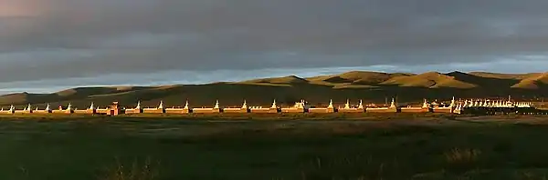 Distant walls, with mountains in the background