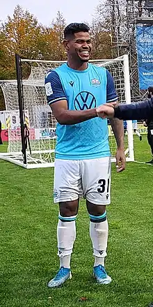 Eriks Santos in uniform, smiling