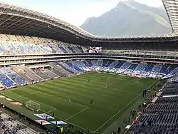 View of Cerro de la Silla from inside Estadio BBVA. It is a soccer stadium with a large mountain standing over the stadium.