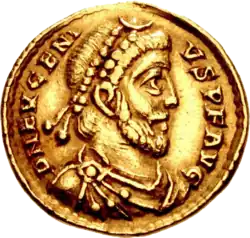 Golden coin depicting bearded man with military attire and diadem, facing right