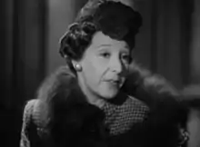 middle-aged white woman in 1940s clothes