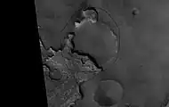 Exhumed Crater in Mare Acidalium, as seen by Mars Global Surveyor.