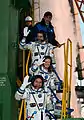 Skvortsov, Caldwell Dyson and Korniyenko wave farewell from the bottom of the Soyuz rocket.