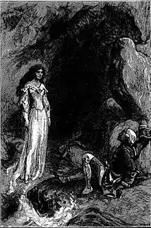 A lady standing at the entrance to a cave and a fallen man facing her.