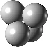 Four white spheres of equal sizes, centered on the vertices of a regular tetrahedron, touch each other.