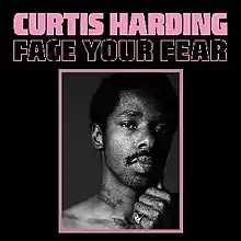 Black-and-white photograph of a man looking into the camera with the words "Curtis Harding" and "Face Your Fear"