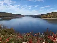 Lake surrounded by a forest in fall colors