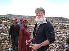 Father Pedro in the rubbish dump.