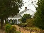 A portion of the front elevation of the Greek Revival main house in 2008