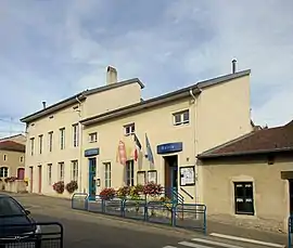 The town hall and school in Favières