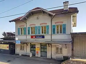 Two-story building viewed from a train