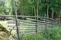 Wooden pole fence in Småland, Sweden