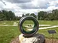 The playground at Fermilab includes a bubble chamber model and a path resembling that followed by protons in a collider