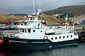 Harbour scene in Sandur. The ferry MV Sildberin to one of the southern islands: Skúvoy.