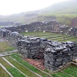 Excavated foundation of mansion house.